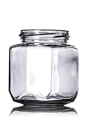 9 oz clear glass oval hex-shaped jar with 63TW neck finish